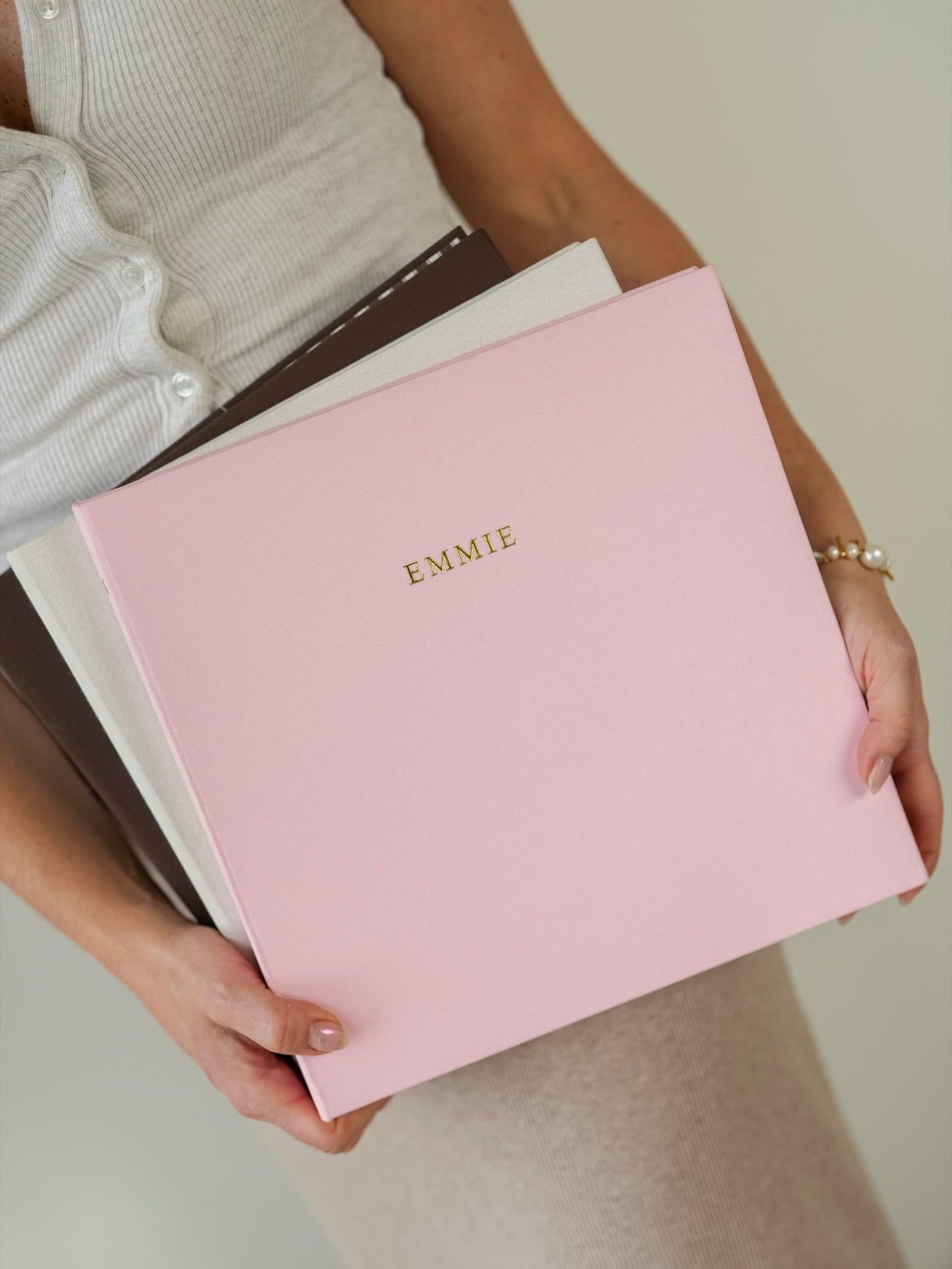 Three bespoke linen albums in Cocoa, Ivory and Rose